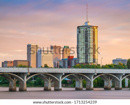 Tulsa, Oklahoma, USA downtown skyline on the Arkansas River at dusk.