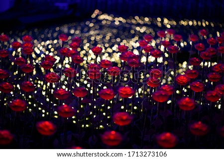 Beautiful red LED flowers and yellow bokeh