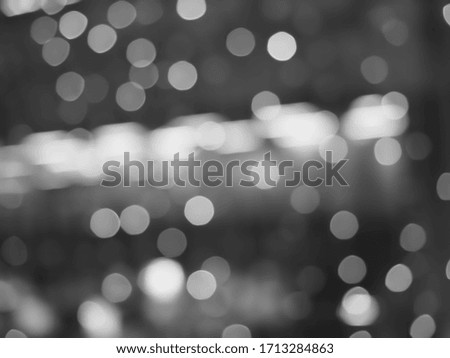 Silver and white glitter abstract bokeh background.