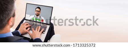 Online Video Chat With Doctor On Computer Royalty-Free Stock Photo #1713325372