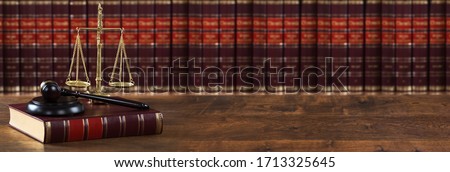 Justice Scales And Legal Law Book Near Mallet  Royalty-Free Stock Photo #1713325645