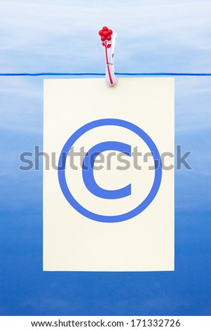 Seamless washing line with paper against a blue sky showing copyright