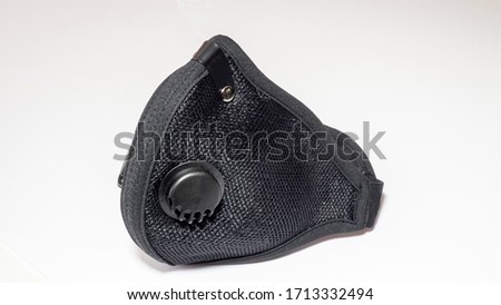 Air filtration mesh mask with active carbon filters. Black medical mask. Face mask protection against pollution, virus, flu and coronavirus. Health care and surgical concept