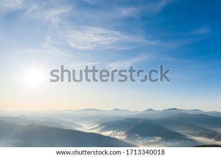 Shining sun at clear blue sky. Beautiful natural wallpaper. Blue sky background in the fresh sunny day. Concept of the ecology. Template textured sky background. Beauty of earth.