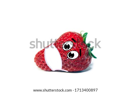 Isolated photo of juicy red strawberry with cartoon eyes wearing a medical mask on white background. Epidemic and virus protection concept. 