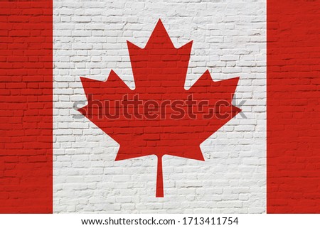 National Canada flag painted on brick wall. Photo collage.