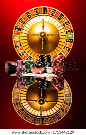 Casino set with Roulette, cards, dice and chips on BlackJack mat