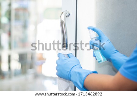 sanitizer spray clean handle door protect virus bacteria corona 2019  Royalty-Free Stock Photo #1713462892