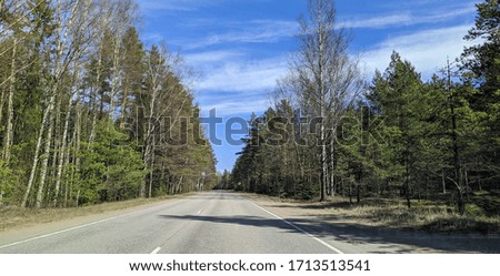 road with horizon on blue sky and clouds in the daytime