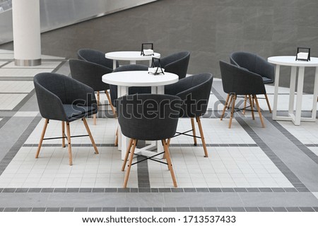 Chairs with a table in the mall. Chairs and table in shopping mall. 