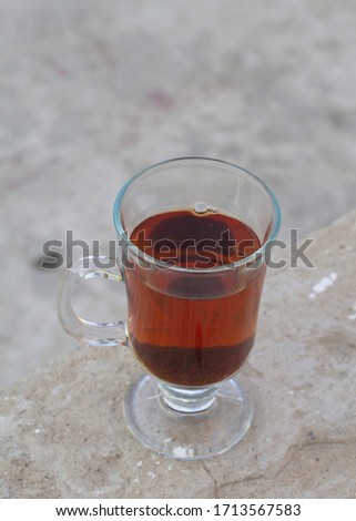 Special red tea in juice glass