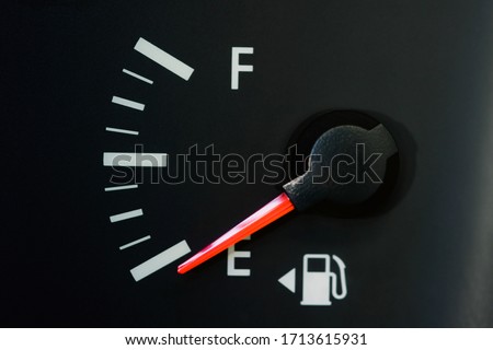Car Fuel Gauge Showing Empty, close up
