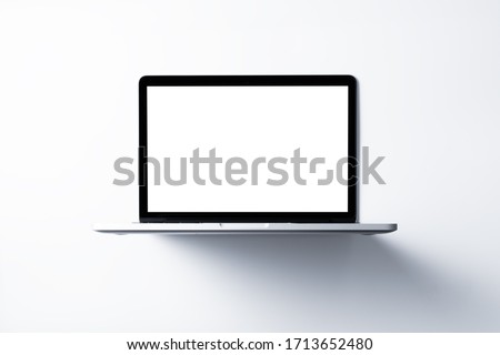 Laptop with blank screen mockup concept. Creative workspace background.
