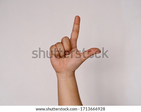 Deaf sign hand language communicate L alphabet Royalty-Free Stock Photo #1713666928