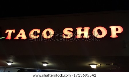 a sign that says taco shop