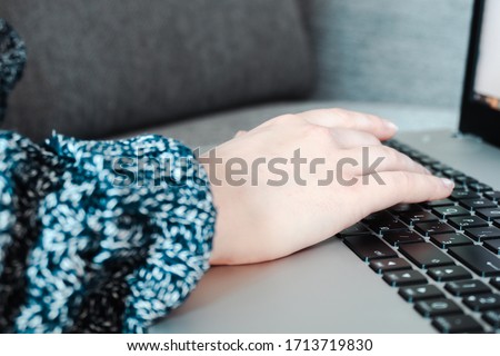 Woman using laptop, searching information on the Internet, having a workplace at home, Vintage concept, remote work, quarantine at home, hands on the keyboard, press a key, banner, copy space, concept