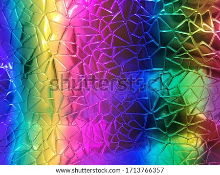 A shiny neon colored surface with many small triangular shaped cells. Concept texture, background.