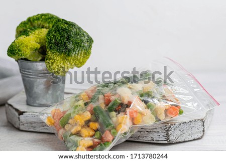 Frozen vegetables. Frozen vegetable mixture of carrots, corn and peas, celery and corn. Mexican mix. On white background.