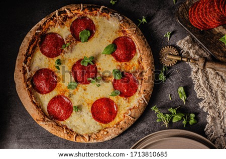 Delicious and simple pizza homemade with sharp salami and cheese corners