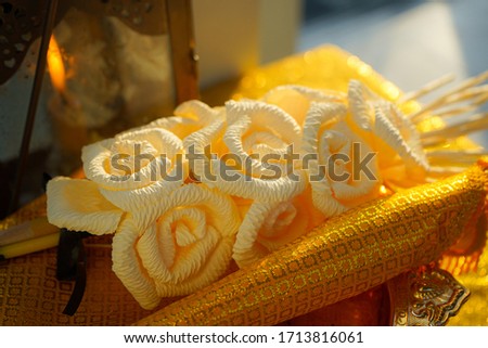 Thai artificial sandalwood flower, leaves from corn plant(Dok Mai Chan), placing on pedestal tray in cremation ceremony or funeral Royalty-Free Stock Photo #1713816061