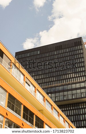 architectural picture with black and orange highrises