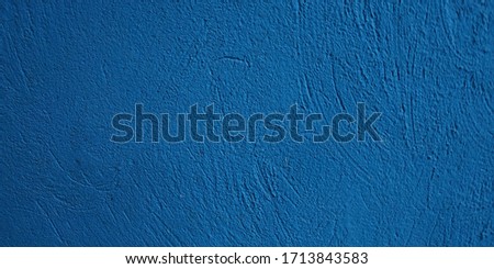 blue concrete wall with relief
