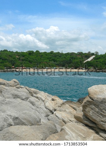 The cliffs by the shore in Puerto Escondido, Mexico by the Pacific Ocean 