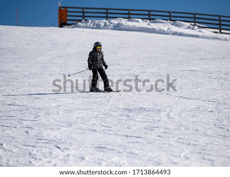 LIttle 8 year old boy skiing during winter holidays at mountain resort of Stara Planina, eastern Serbia