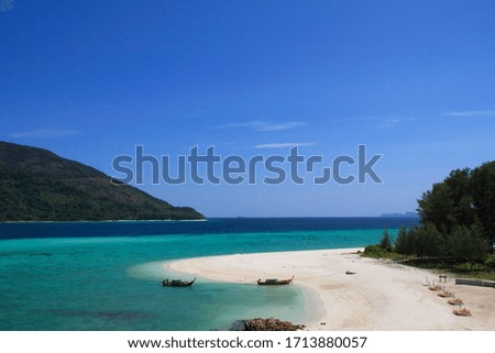 Seascape pictures of beautiful white beaches, turquoise seas and blue skies at Koh Lipe, southern of Thailand. In the summer that is best for traveling and relaxing. Copy space on top of image.