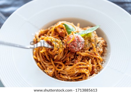  Italian pasta on a fork in a white plate 