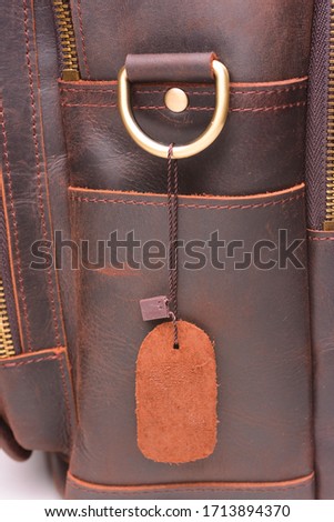 Leather tag on a new bag, close-up