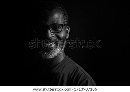 Artistic black and white portrait of a bearded black man Royalty-Free Stock Photo #1713907186