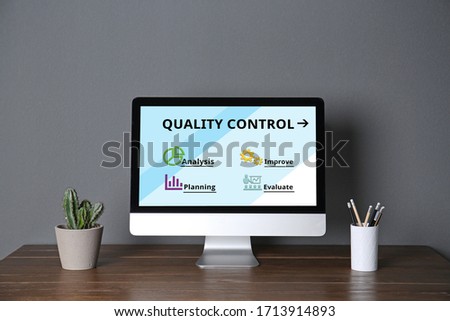 Quality control service. Modern computer on table in office