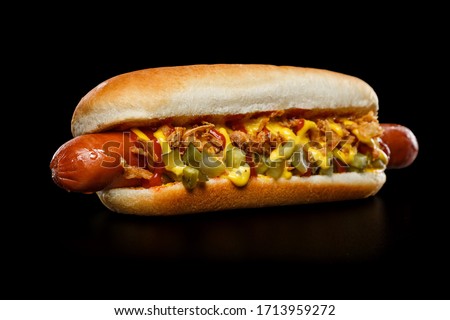 Hot Dog on black background Royalty-Free Stock Photo #1713959272