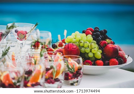 Catering on the street with fruits and cocktails.