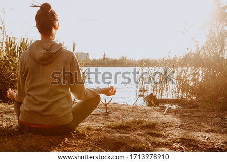 Yoga in the park, health woman. Concept of healthy lifestyle and relaxation