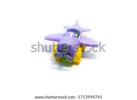 small color children`s airplane from the designer on a white background