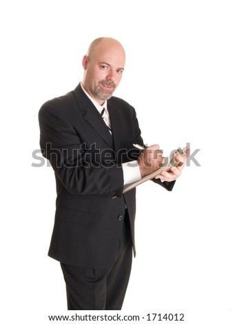 Stock photo of a well dressed businessman making notes on a clipboard, isolated on white.