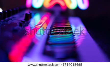 Synthesizer in the light of night lights Royalty-Free Stock Photo #1714018465