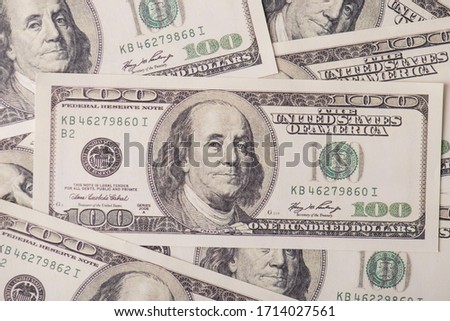 Earnings revenue profit debt debit laundry loan success royalty concept. Close up view photo of background made of 100 banknotes