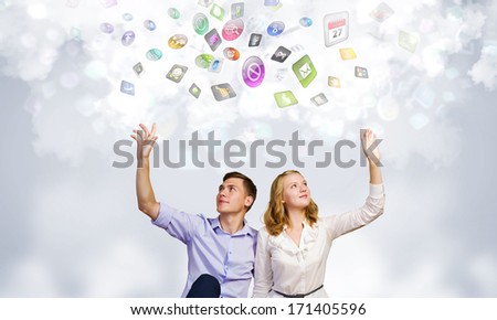 Conceptual image of young couple sitting on floor