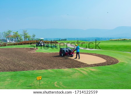 Repairing lawn on the putting green golf course