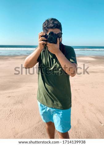 
A young photographer doing a summer session on the beach