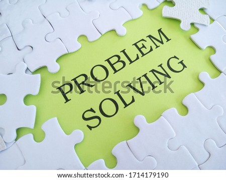 white puzzle paper with word PROBLEM SOLVING