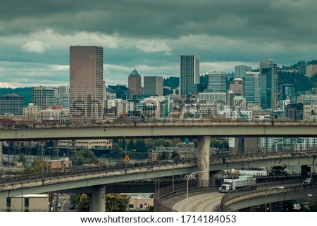 Portland, Oregon / USA - April 24 2020: The Portland skyline and highway interchanges on an overcast day. Traffic is at a minimum due to the COVID 19 pandemic.