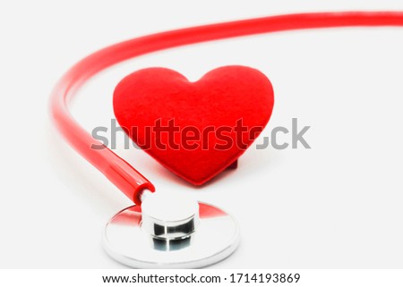 Selective focus Red Medical stethoscope and heart isolated on white background,health care concept