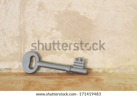 vintage key on old paper, background