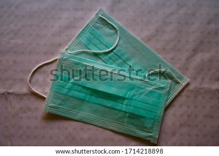 A pair of triple layered surgical mask for hospital use and personal protection