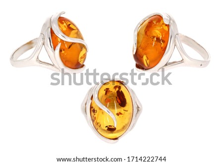 Amber jewelry ring. Natural Baltic amber. Isolated cut out image. Vintage and modern style fashion jewelry. Royalty-Free Stock Photo #1714222744