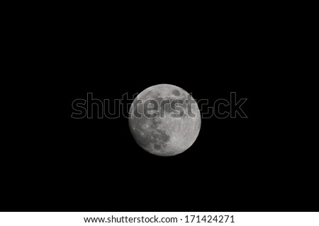 One Full Moon over a Dark Black Sky